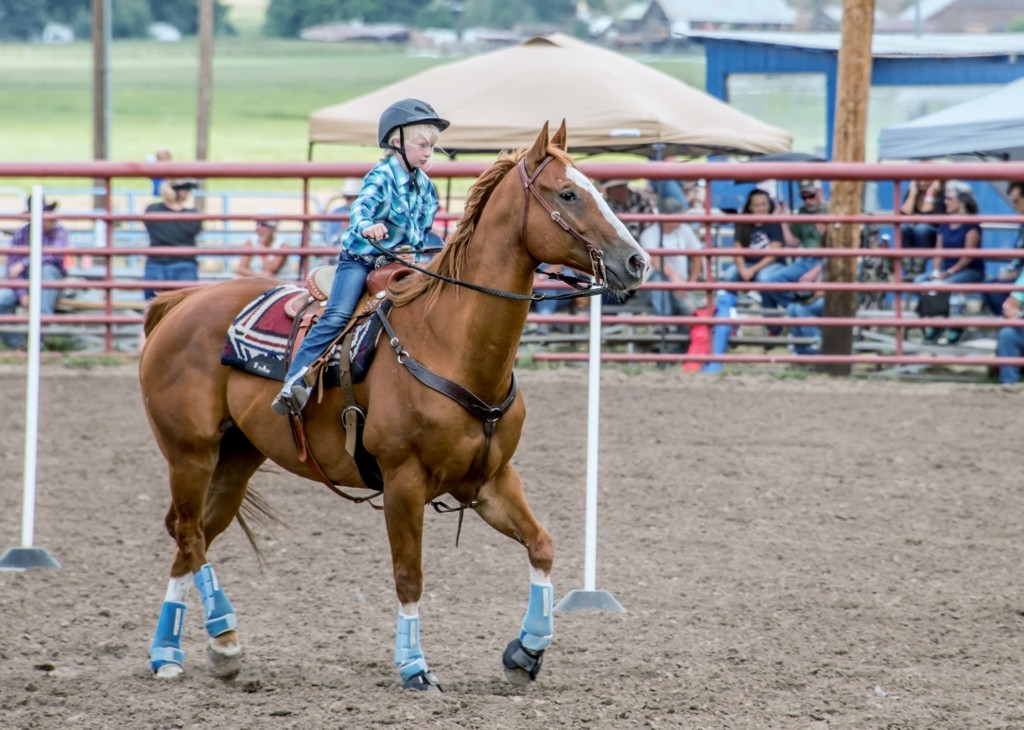 Child riding a horse